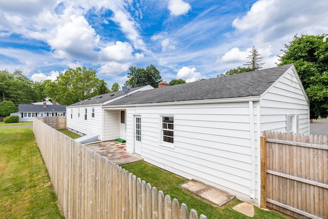 51 Euston St, New Britain, CT 06053 - view of front of house with a fenced backyard, a shingled roof, and a chimney