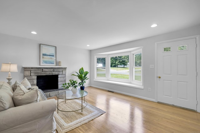 64 Ridgefield Rd, Wallingford, CT 06492 - living area featuring light wood-style flooring, a fireplace, and recessed lighting