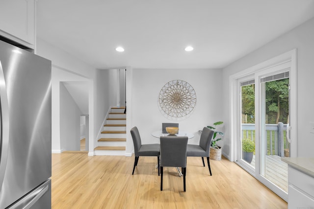 64 Ridgefield Rd, Wallingford, CT 06492 - dining room with light wood finished floors, stairway, and recessed lighting