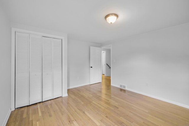 64 Ridgefield Rd, Wallingford, CT 06492 - unfurnished bedroom featuring light wood-style floors and a closet