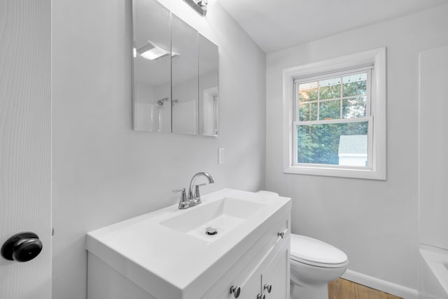 64 Ridgefield Rd, Wallingford, CT 06492 - bathroom with vanity, wood finished floors, and a tub