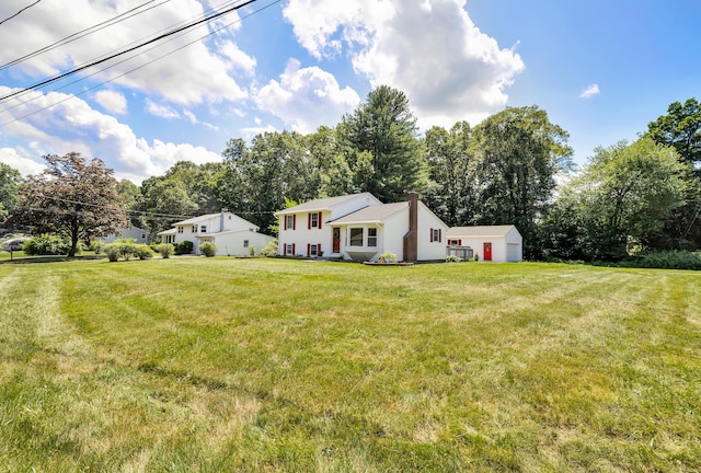 64 Ridgefield Rd, Wallingford, CT 06492 - view of grassy yard with an outbuilding and view of scattered trees