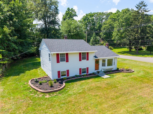 64 Ridgefield Rd, Wallingford, CT 06492 - view of front of property featuring a chimney, a front lawn, and roof with shingles