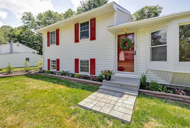 64 Ridgefield Rd, Wallingford, CT 06492 - tri-level home featuring a front lawn