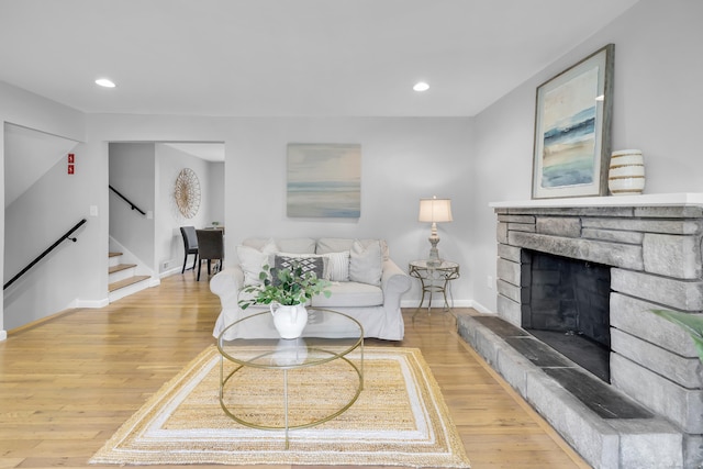 64 Ridgefield Rd, Wallingford, CT 06492 - living area with stairway, light wood finished floors, a stone fireplace, and recessed lighting