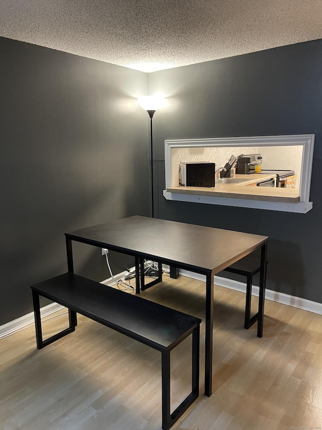 122 Trolley Crossing Ln Unit 122, Middletown, CT 06457 - dining room with wood finished floors and a textured ceiling