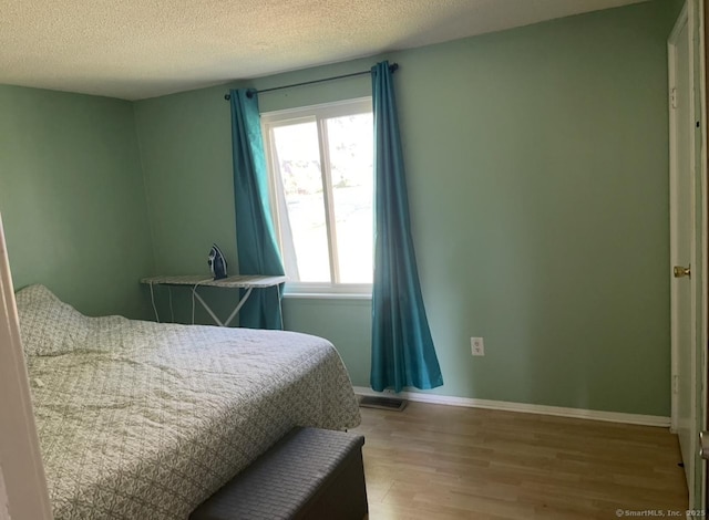 122 Trolley Crossing Ln Unit 122, Middletown, CT 06457 - bedroom featuring light wood-type flooring and a textured ceiling