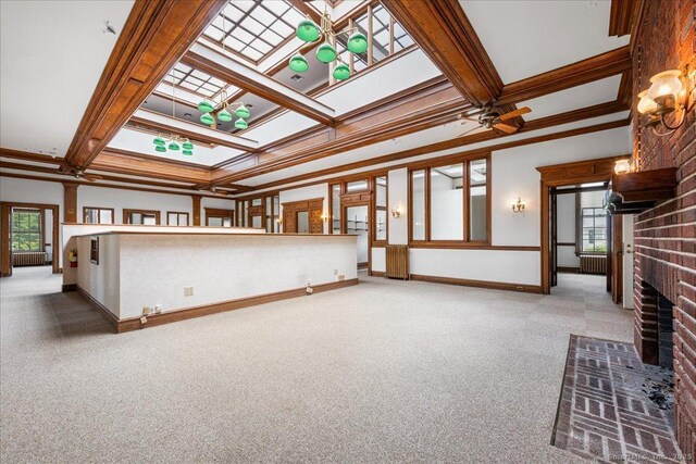 31 N Main St, Essex, CT 06426 - unfurnished living room featuring carpet, a brick fireplace, coffered ceiling, ornamental molding, and ceiling fan