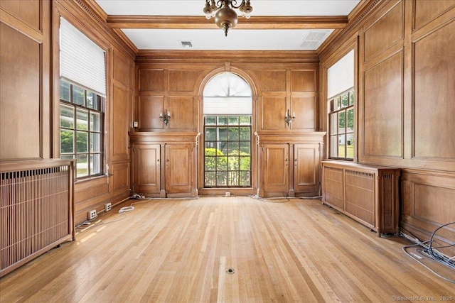 31 N Main St, Essex, CT 06426 - unfurnished office with light wood-type flooring, plenty of natural light, a decorative wall, beam ceiling, and crown molding