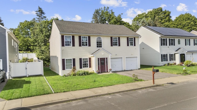20 Society Hill Rd, Waterbury, CT 06704 - colonial home featuring asphalt driveway, a garage, and a gate