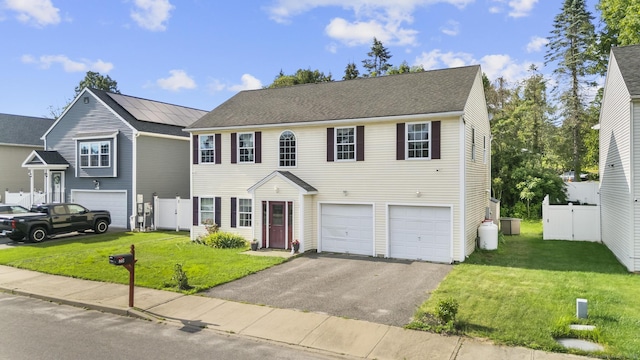 20 Society Hill Rd, Waterbury, CT 06704 - colonial house with asphalt driveway and an attached garage