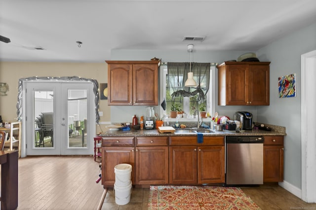 20 Society Hill Rd, Waterbury, CT 06704 - kitchen featuring stainless steel dishwasher, pendant lighting, brown cabinetry, and french doors