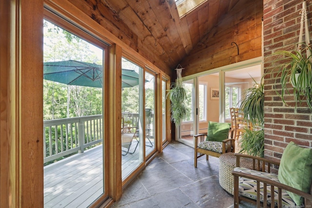 223 N St, Ridgefield, CT 06877 - sunroom / solarium featuring stone tile flooring, vaulted ceiling, wooden ceiling, and a skylight