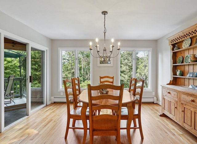 223 N St, Ridgefield, CT 06877 - dining area featuring a chandelier, light wood finished floors, and a baseboard heating unit