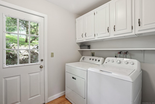 223 N St, Ridgefield, CT 06877 - laundry room featuring cabinet space, independent washer and dryer, plenty of natural light, and light wood finished floors