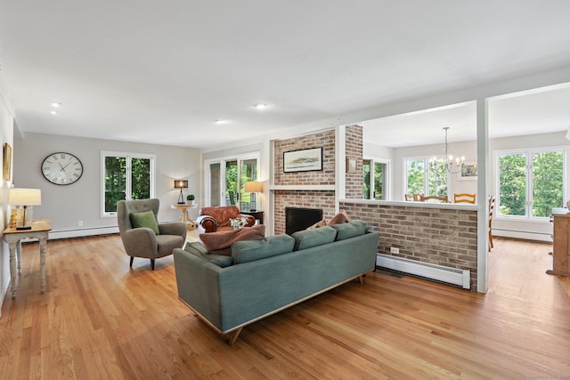 223 N St, Ridgefield, CT 06877 - living area with a baseboard heating unit, baseboard heating, light wood-style flooring, and plenty of natural light