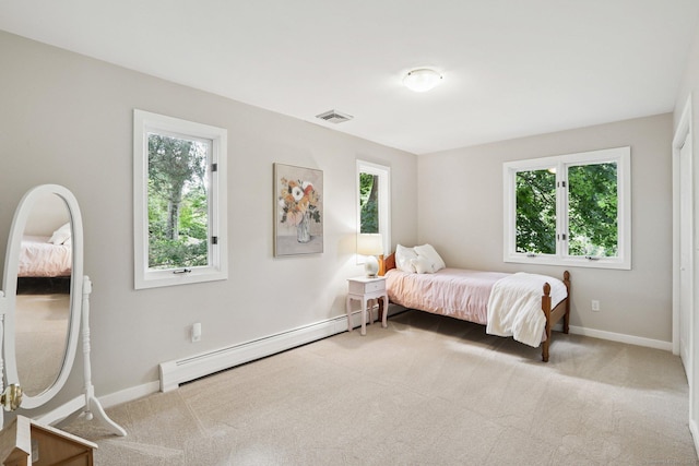 223 N St, Ridgefield, CT 06877 - carpeted bedroom featuring a baseboard heating unit and multiple windows