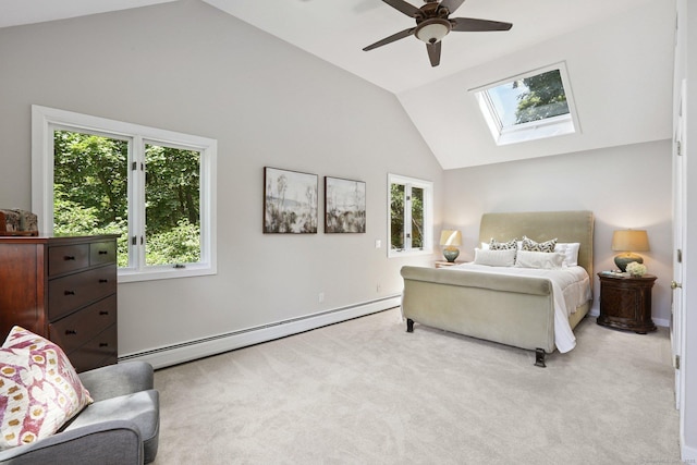 223 N St, Ridgefield, CT 06877 - carpeted bedroom with a baseboard heating unit, multiple windows, a skylight, high vaulted ceiling, and a ceiling fan