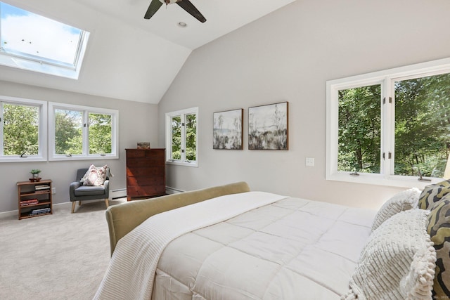 223 N St, Ridgefield, CT 06877 - bedroom with lofted ceiling, carpet, a skylight, a ceiling fan, and a baseboard radiator