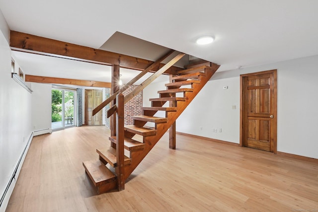 223 N St, Ridgefield, CT 06877 - staircase featuring baseboard heating and wood finished floors