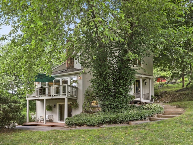 223 N St, Ridgefield, CT 06877 - back of property featuring a balcony and a chimney