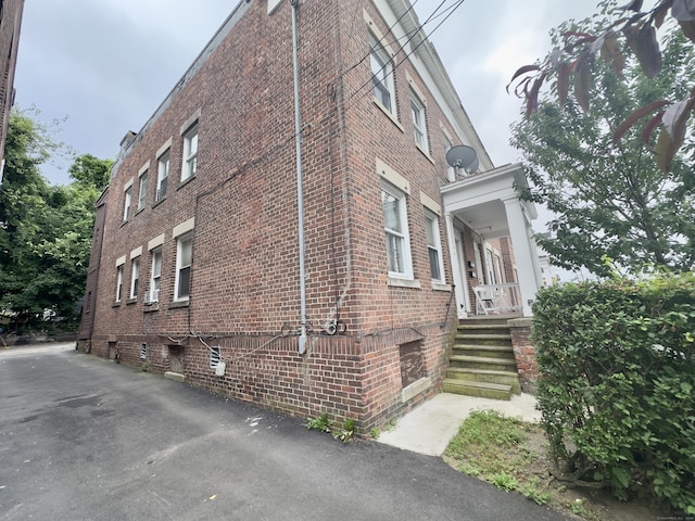 310 Bond St, Bridgeport, CT 06610 - view of property exterior featuring brick siding