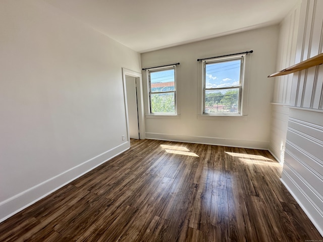 310 Bond St, Bridgeport, CT 06610 - spare room featuring dark wood finished floors and baseboards