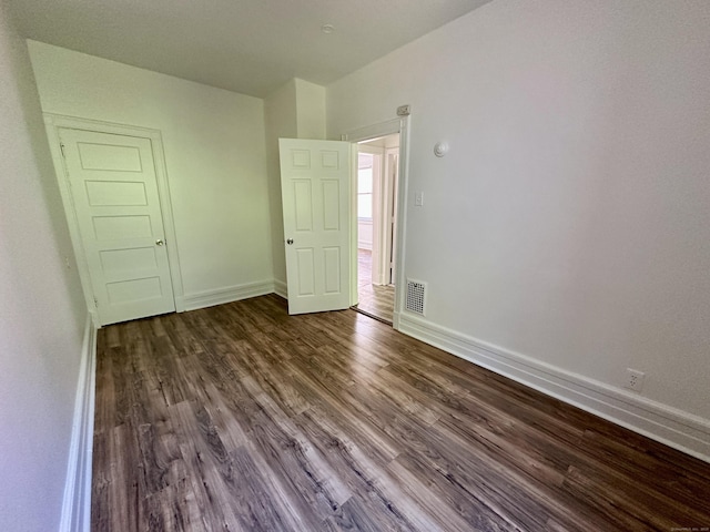 310 Bond St, Bridgeport, CT 06610 - unfurnished room with baseboards and dark wood finished floors