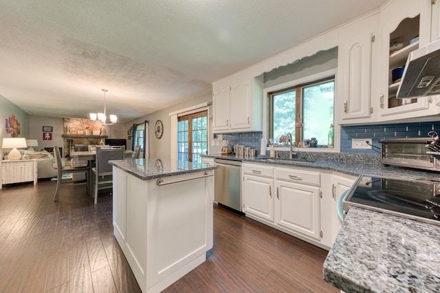 279 Annelise Ave, Southington, CT 06489 - kitchen with appliances with stainless steel finishes, a center island, a chandelier, tasteful backsplash, and white cabinets