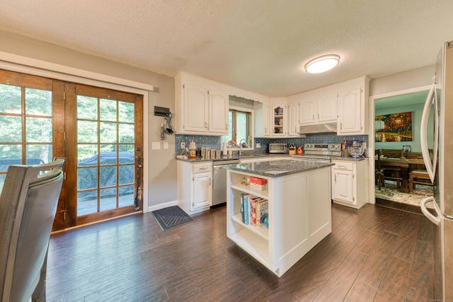 279 Annelise Ave, Southington, CT 06489 - kitchen with appliances with stainless steel finishes, under cabinet range hood, open shelves, a textured ceiling, and white cabinetry