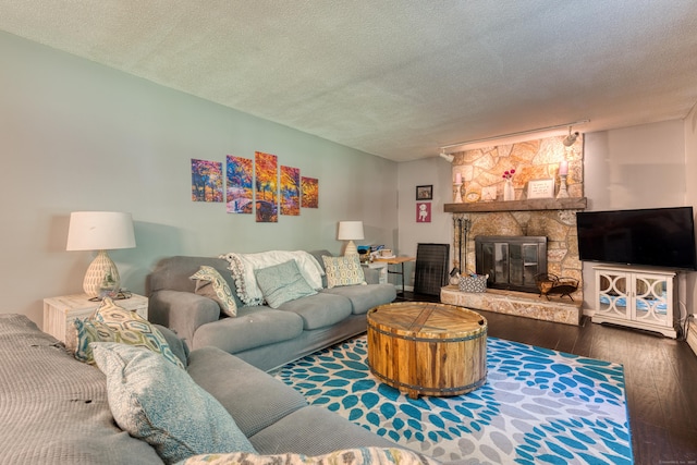 279 Annelise Ave, Southington, CT 06489 - living area with hardwood / wood-style flooring, a textured ceiling, and a fireplace