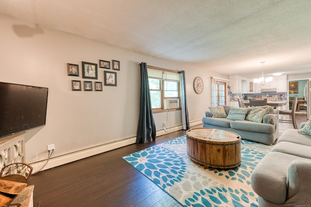 279 Annelise Ave, Southington, CT 06489 - living room with a baseboard heating unit, a chandelier, a textured ceiling, and wood finished floors