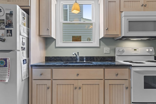 30 Hartford Ave Unit A, Old Lyme, CT 06371 - kitchen featuring white appliances, dark stone counters, and decorative light fixtures