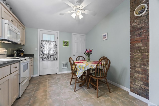 30 Hartford Ave Unit A, Old Lyme, CT 06371 - kitchen featuring white appliances, a ceiling fan, dark countertops, light tile patterned flooring, and lofted ceiling