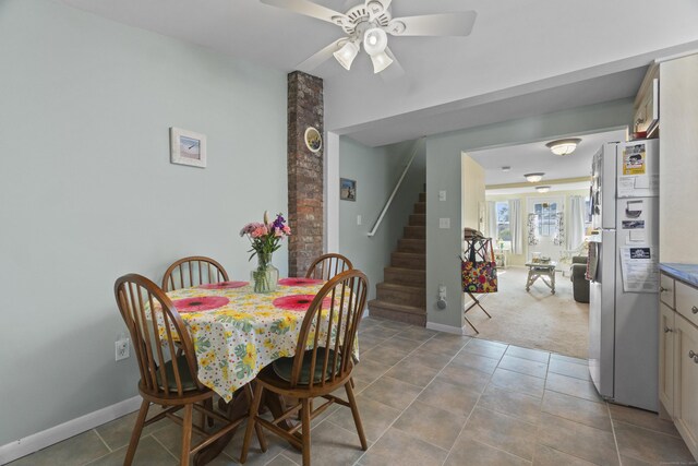 30 Hartford Ave Unit A, Old Lyme, CT 06371 - carpeted dining area featuring stairway, ceiling fan, and tile patterned floors