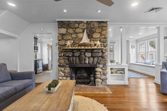 30 New Britain Rd, Old Lyme, CT 06371 - living area featuring crown molding, wood finished floors, and a stone fireplace