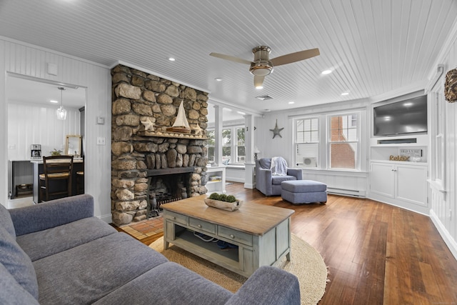 30 New Britain Rd, Old Lyme, CT 06371 - living area with a ceiling fan, hardwood / wood-style floors, ornamental molding, a baseboard radiator, and a fireplace