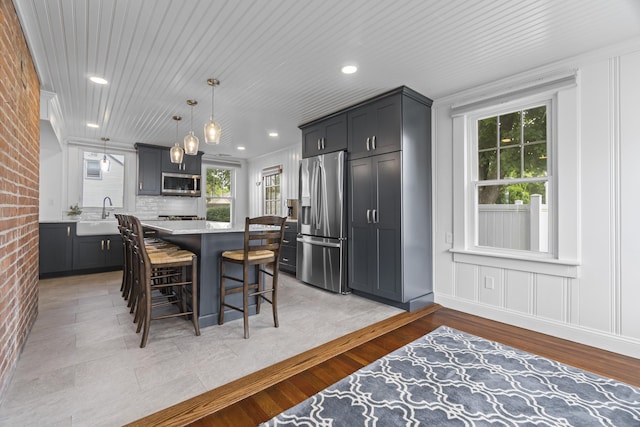 30 New Britain Rd, Old Lyme, CT 06371 - kitchen featuring stainless steel appliances, light countertops, plenty of natural light, a breakfast bar, and recessed lighting