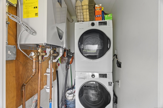 30 New Britain Rd, Old Lyme, CT 06371 - laundry room with tankless water heater and stacked washer and clothes dryer