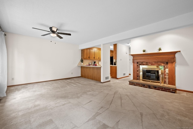 1325 Farmington Ave Apt 11, Bristol, CT 06010 - unfurnished living room with ceiling fan, a brick fireplace, and light carpet