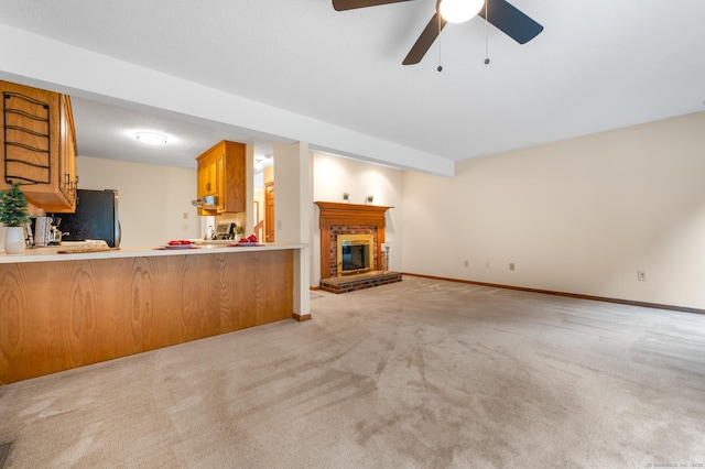 1325 Farmington Ave Apt 11, Bristol, CT 06010 - unfurnished living room with light carpet, a ceiling fan, and a brick fireplace