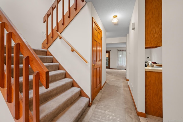 1325 Farmington Ave Apt 11, Bristol, CT 06010 - staircase featuring carpet flooring and baseboards