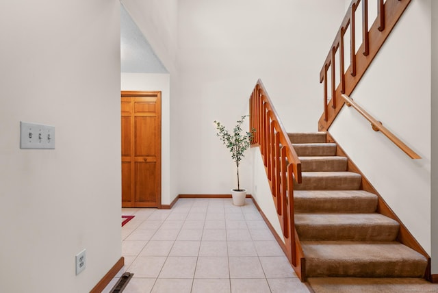 1325 Farmington Ave Apt 11, Bristol, CT 06010 - entryway with stairway, a towering ceiling, and light tile patterned floors
