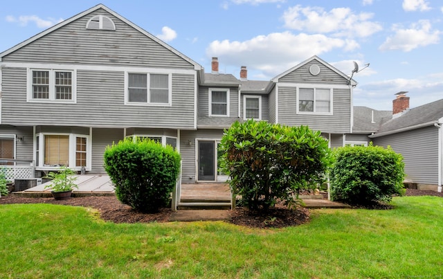 1325 Farmington Ave Apt 11, Bristol, CT 06010 - back of property featuring a deck, a yard, and a chimney