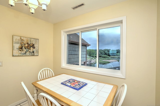 2 Old Town Hwy Unit 45, East Haven, CT 06512 - dining room featuring a chandelier and baseboards