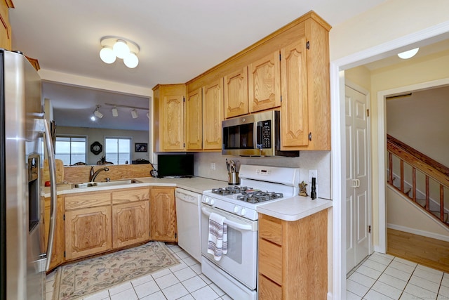 2 Old Town Hwy Unit 45, East Haven, CT 06512 - kitchen with white appliances, light tile patterned floors, light countertops, and rail lighting