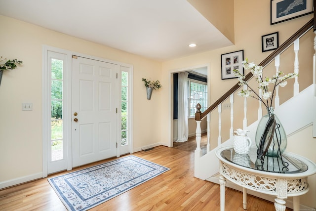 341 W Mountain Rd, Simsbury, CT 06092 - entrance foyer with plenty of natural light, stairs, light wood-style floors, and recessed lighting