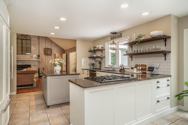 341 W Mountain Rd, Simsbury, CT 06092 - kitchen with open shelves, light tile patterned floors, decorative backsplash, stainless steel gas cooktop, and recessed lighting