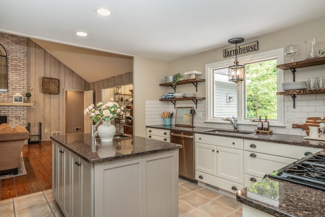 341 W Mountain Rd, Simsbury, CT 06092 - kitchen with open shelves, stainless steel dishwasher, lofted ceiling, decorative backsplash, and a center island