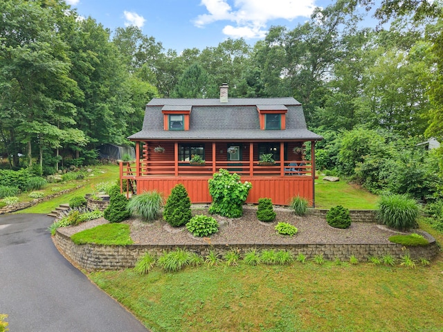 40 Devonshire Dr, Waterford, CT 06385 - log home featuring a chimney, covered porch, log siding, and roof with shingles